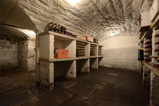 Inside the property is a useful larder room fitted with shelving and stairs that lead down to the Victorian double barrelled vaulted wine cellar, which is ideal for wine storage.