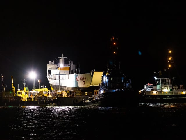 LCT 7074 is carried on the barge and sailed into position. Picture Credit: Keith Woodland