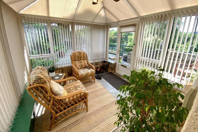 The conservatory is described as a "super addition to this home, providing a room for all seasons".