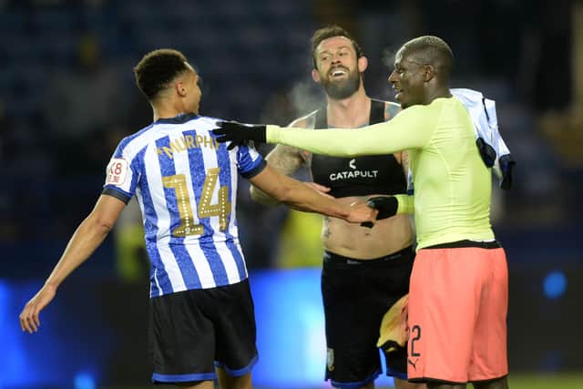 Sheffield Wednesday's Steven Fletcher swaps shirts with City's Benjamin Mendy at full time. They were team-mates at Marseille. Pic Steve Ellis