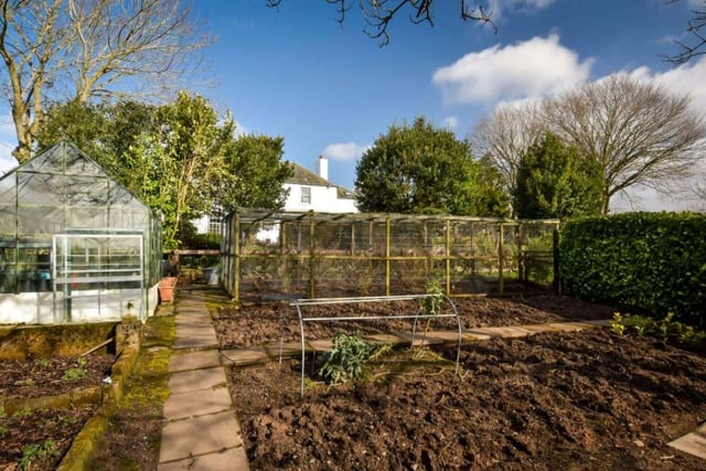 The property also features a vegetable garden set up with fruit cages, raised beds, composting areas and a greenhouse as well