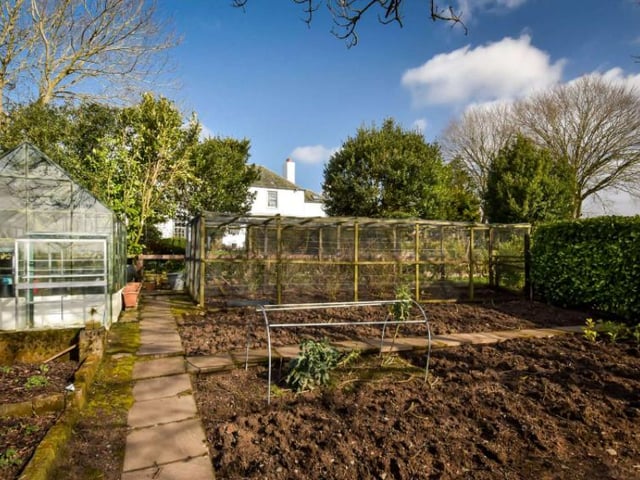 The property also features a vegetable garden set up with fruit cages, raised beds, composting areas and a greenhouse as well