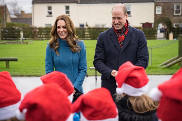 The Duke and Duchess chat to Year 4 pupils who sang 'It Was On A Starry Night'. Picture: Dawn Robertson