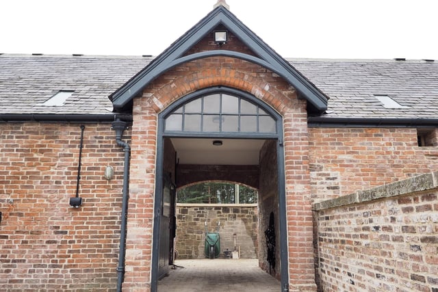 The imposing arch leading to the police stables.