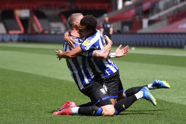 Jacob Murphy and Connor Wickham celebrate Sheffield Wednesday's opener against Bristol City on Sunday. Pic: Action Plus Sports
