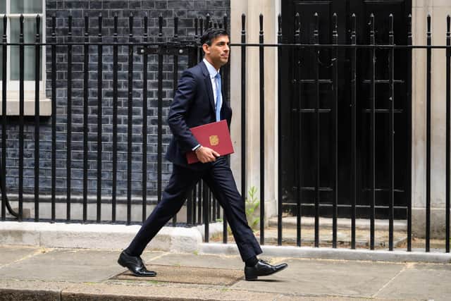 Chancellor Rishi Sunak also announced additional support measures including a £650 payment to low-income households, a £300 payment for pensioners who receive the winter fuel allowance, and a one-off disability payment of £150. (Photo by Leon Neal/Getty Images)