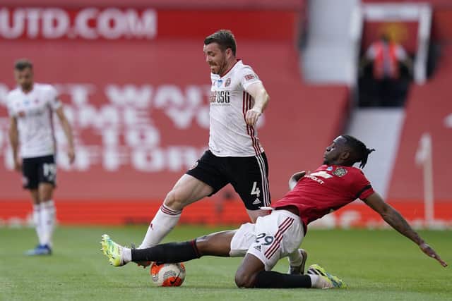 John Fleck, pictured in action against Manchester United, should be available for Sheffield United's final two games of the Premier League season: Andrew Yates/Sportimage