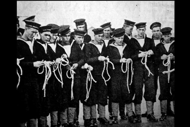 New entrants into the navy are being taught how to tie knots at HMS Collingwood, Fareham in November 1940.
