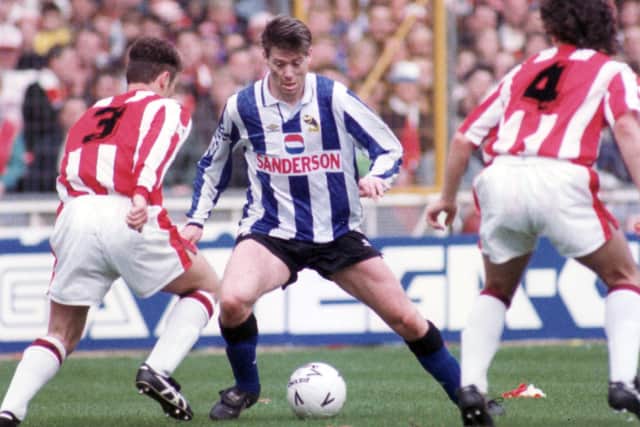 Sheffield Wednesday legend Chris Waddle shimmies past a pair of Blades rivals during the 1993 FA Cup semi-final.
