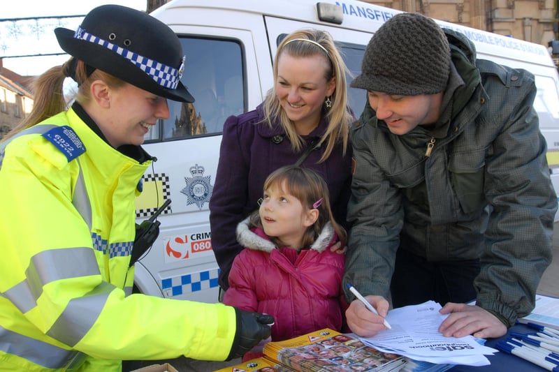 PCSO Lydia Sawyer talks to the public at a neighbourhood police day on Mansfield Market Place.