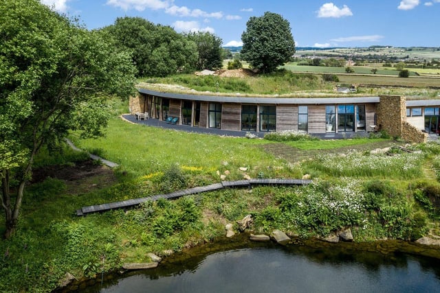 Set beautifully into the landscape, this unique three bedroom family home combines modern living with an eco-friendly design in a stunning rural location.
