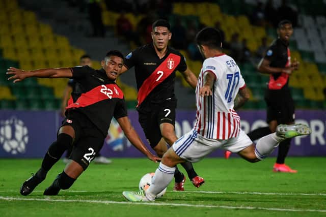 Peruvian midfielder Yuriel Celi (centre) has been linked with Sheffield United (Photo by JUAN BARRETO/AFP via Getty Images).