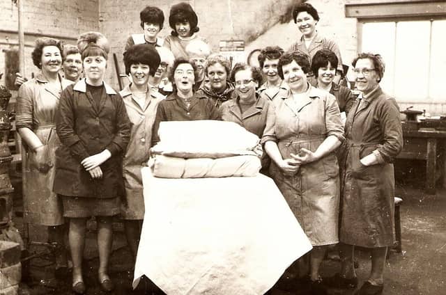 A worker enjoys her leaving presents at the Firth Vickers test house on Weedon Street, Sheffield, in the early1960s. Photo Mrs Patricia Henshaw