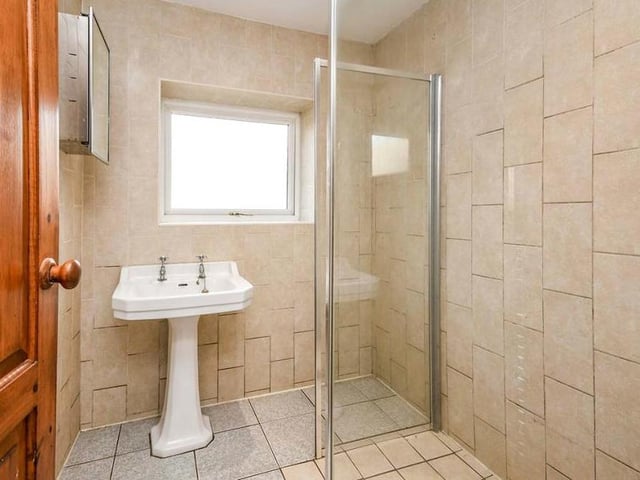 The ground floor also has its own modern and fully tiled shower-room. As well as the walk-in shower, with glass screen, there is a wash hand basin.