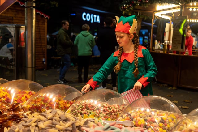 Elf Mia Wright (9) (from the Surrender Dance Academy) sampling the sweets at the Christmas market. Picture: Mike Cooter (181121)