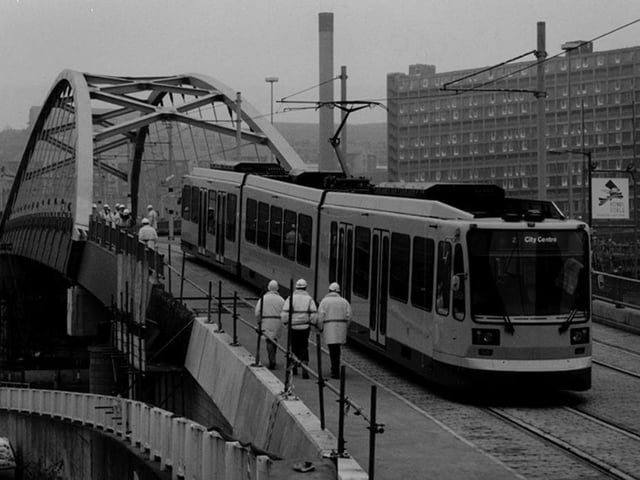 Sheffield Supertram on its first trial run from Nunnery Depot in 1993 as it reaches Commercial Street
