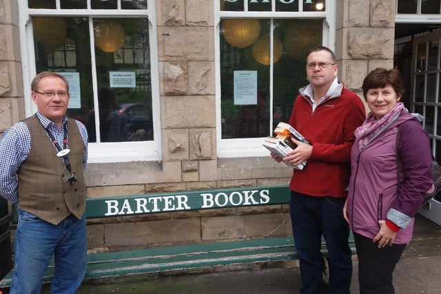 Brian and Julie Lee-Roffe, who travelled from Sunderland to Alnwick, to visit Barter Books. Pictured with Mike Shepherd from the shop.