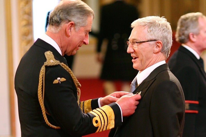 Paul O’Grady being made a Member of the Order of the British Empire by the then Prince of Wales (now King Charles III), at Buckingham Palace in 2008.