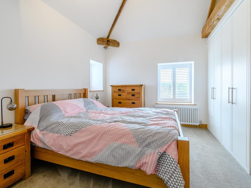 One of three bright, airy and luxurious bedrooms in the main home at Warren Farm. Planning permission has been acquired for two other homes on site.