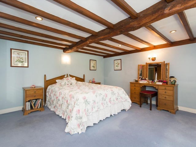 Estate agent Knight Frank says the six-bedroom house is nestled into the surrounding woodland and hillside with mature gardens, stream and waterfalls within the 40-acre estate.