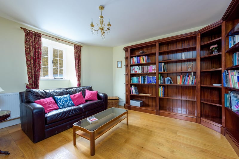 Currently used as a library, this room could also be adapted into a home office space, playroom or a cosy cinema room.