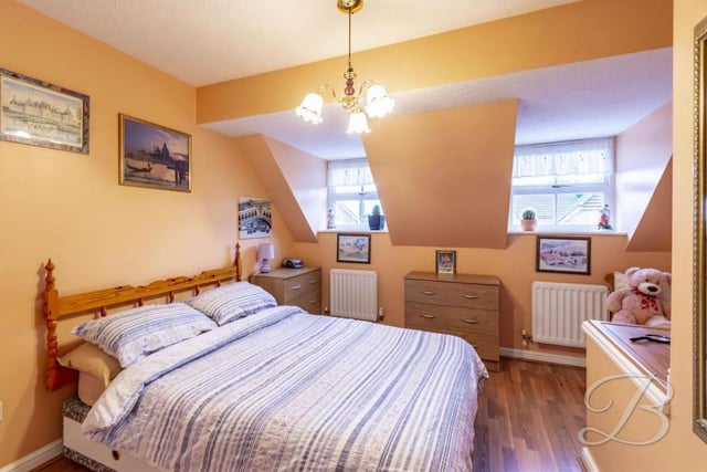 The main bedroom has a built-in wardrobe, storage cupboard, central-heating radiator and two windows to the front of the property. It is bigger than this photo suggests!