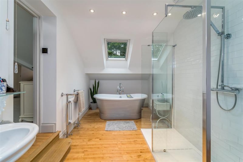 Stylish and contemporary, the bathroom includes a good-sized glass shower cubicle.