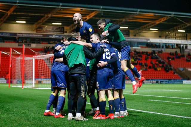 Stags celebrate midfielder George Lapslie's second goal against Doncaster.