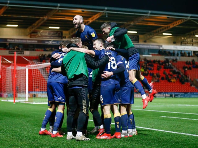 Stags celebrate midfielder George Lapslie's second goal against Doncaster.