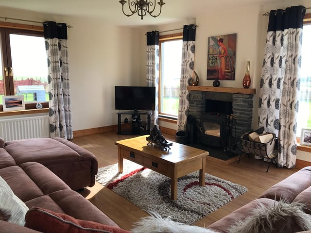 The cosy living room offers unrivalled views across the countryside