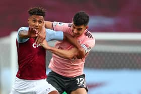 Sheffield United defender John Egan tussles with Aston Villa striker Ollie Watkins in an incident which led to the Blades man red-carded by referee Graham Scott for denying a goalscoring opportunity at Villa Park last night  (Photo by CLIVE ROSE/POOL/AFP via Getty Images)