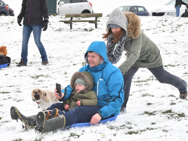 Evelyn Boom pushes Paul and George Higgs on the sled in March 2018. Picture: Keith Woodland