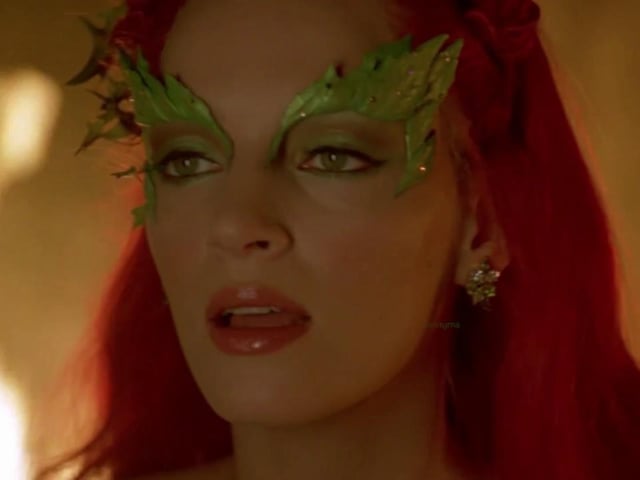 Simple and easy, this look only requires a dash of bright red lipstick and decorative green eyeshadow. For the finishing touches add a red wig and some leaves to your hair.