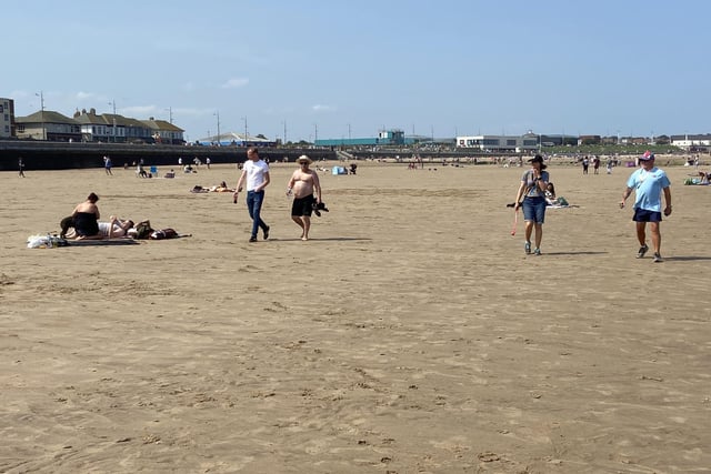 People have been told they should still keep their distance from those not from their household or social bubble, with lots of room on the beach for walkers.
