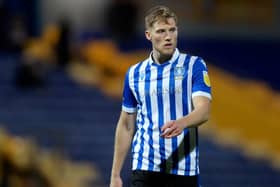 Former Sheffield Wednesday loanee Lewis Gibson has signed for Bristol Rovers.