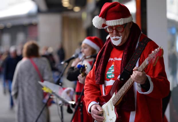 Santa suits on show as musicians perform in Doncaster town centre