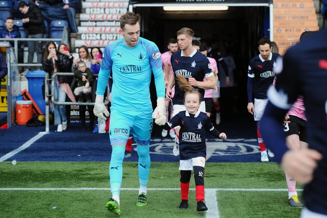 Mascot Amy Russell kept Robbie Mutch company as the teams entered the pitch.