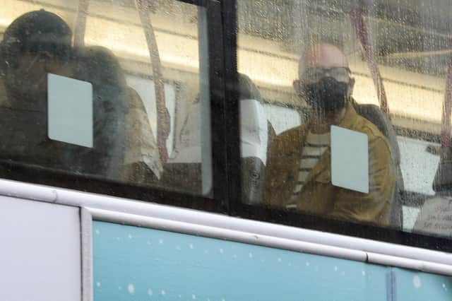 Public transport users in South Yorkshire wearing masks as they travel by bus