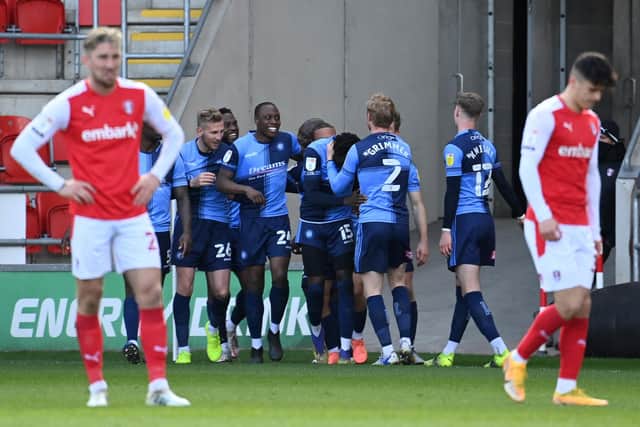 David Wheeler of Wycombe Wanderers (obscured) celebrates with teammates after scoring their team's third goal during the Sky Bet Championship match between Rotherham United and Wycombe Wanderers at AESSEAL New York Stadium. (Photo by Ross Kinnaird/Getty Images)