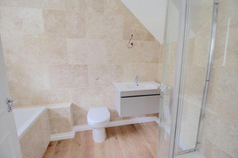 This attractively decorated four-piece en suite is attached to the master bedroom. It comprises bath, separate shower cubicle, wash hand basin and WC.