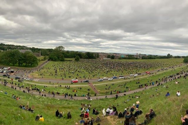 Thousands of protesters can be seen social distant protesting as more gather in Holyrood Park for the Black Lives Matter protest