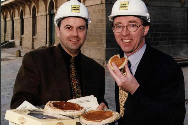 Pat Coffey (right) enjoyed a traditional Bakewell pudding with Tony Gould, Managing Director of Gold. The local dessert is just one of the many delicious refreshments available at the Peak Village Outlet Shopping and Leisure Centre back in 1999