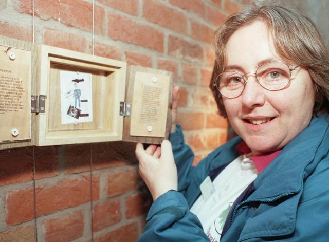 Caroline Taylor at the Doncaster Point with art work created by a patient at St John's Hospice, 2000.