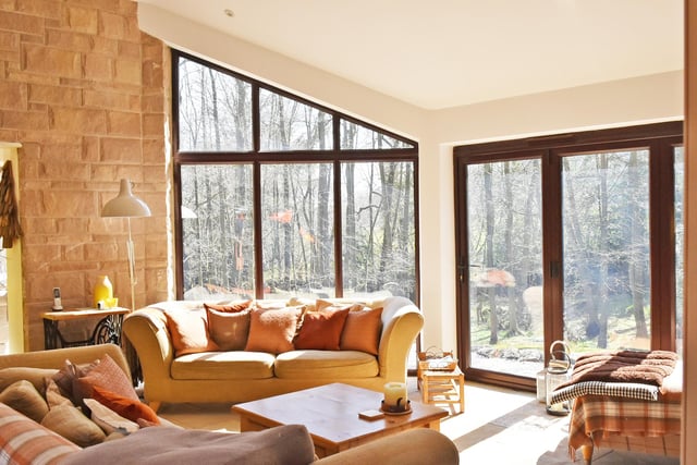 This room has large windows to take in the woodland.