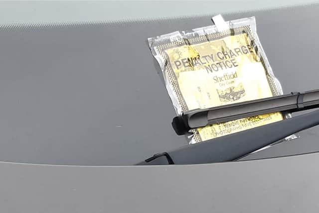 Picture shows a parking ticket issued near Sheffield city centre. Police have revealed tough new rules are in the pipeline to ban people from parking on pavements in the city centre