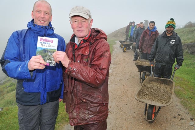 Author Mark Reid (left) with Peak District National Park ranger Terry Page as the path is constructed by volunteer helpers from the Oldham and Rochdale Groundwork Trust in 2008