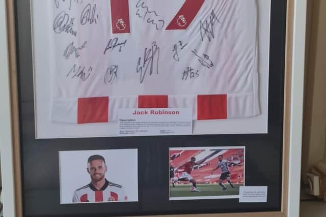 Sheffield United defender Jack Robinson has donate this shirt signed by the team to Doris Banham Dog Rescue.
