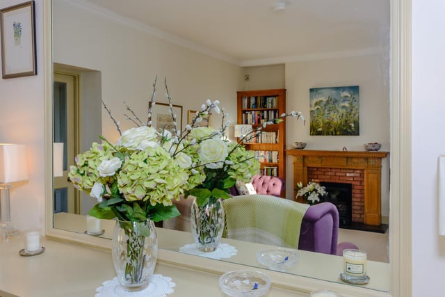 The drawing room has a bay window overlooking the gardens, and has its own doorway to the garden.