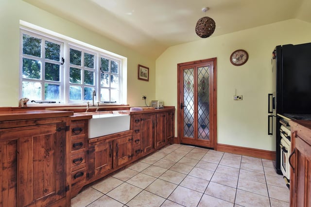 The country style kitchen has access to a W.C and a boot room.