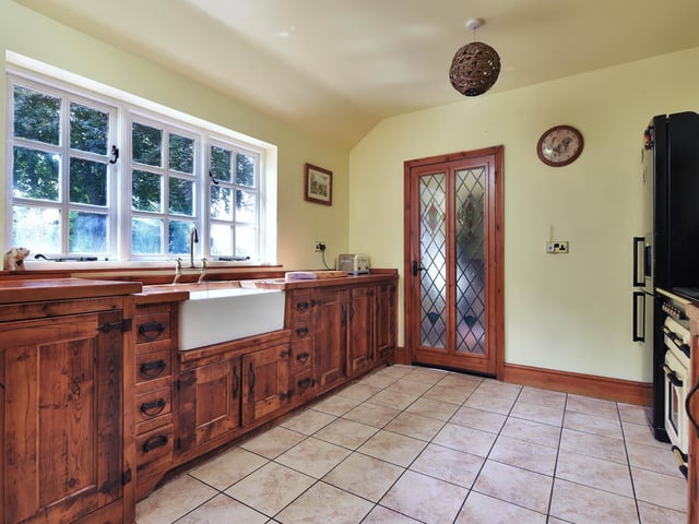 The country style kitchen has access to a W.C and a boot room.